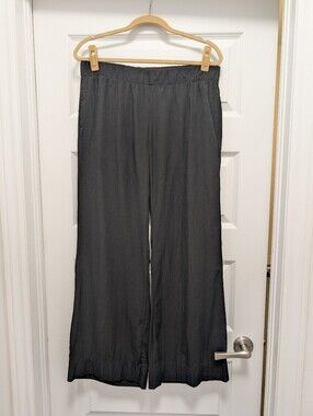 CABI wide leg lightweight black pants. Elasitc waistband otherwise not stretchy.